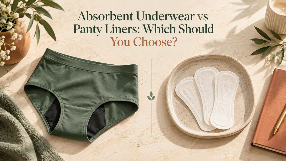 Green absorbent underwear next to three panty liners on a stone tray
