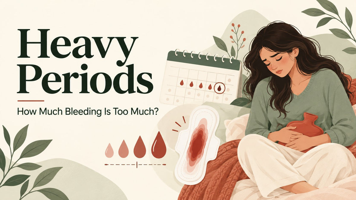 Woman with a hot water bottle on a heavy period day, with a soaked pad and blood drops showing light to heavy flow