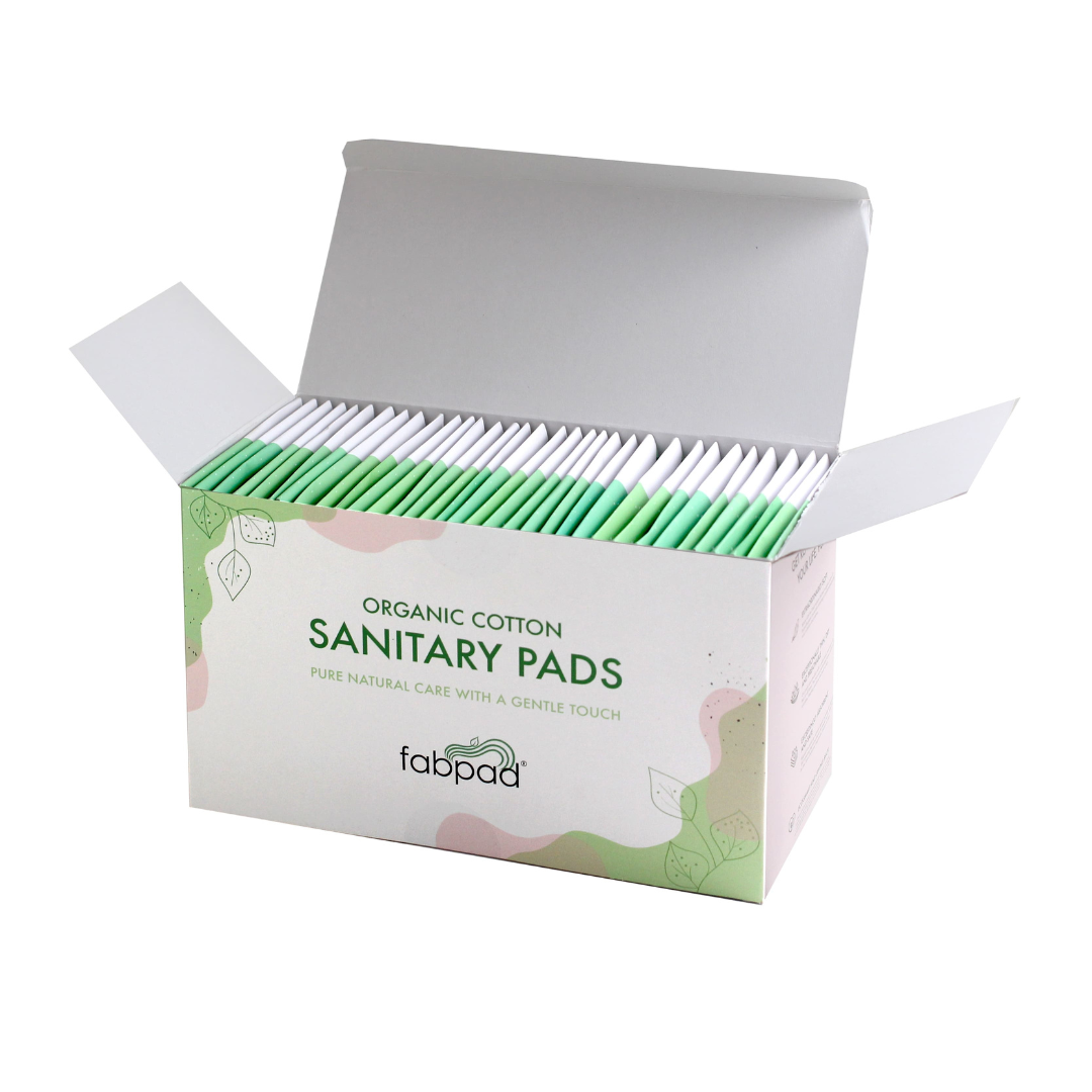 Box of organic cotton sanitary pads with 'fabpad' branding on a white background