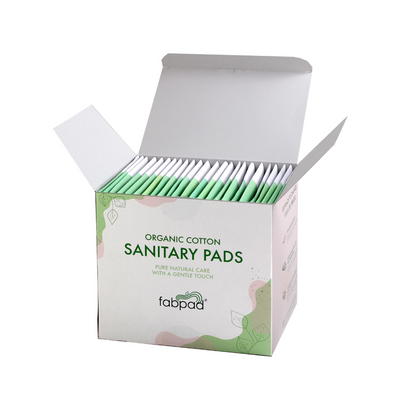 Box of organic cotton sanitary pads with 'fabpad' branding on a white background