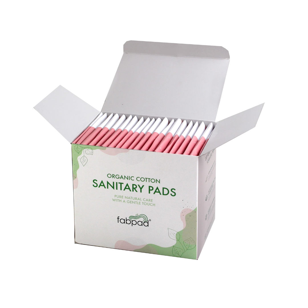 Box of organic cotton sanitary pads with 'fabpad' branding on a white background