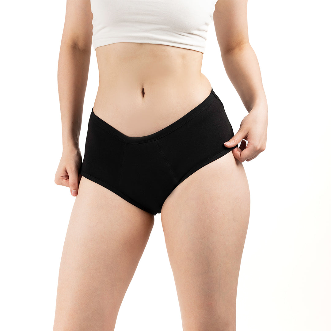 This image features a pair of highly absorbent, reusable period panties designed for teen girls. The panties are black, offering a sleek and simple look.